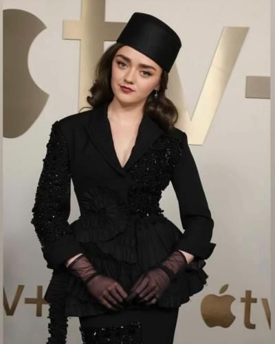 Maisie Williams Shines in Chic Black Outfit and Stylish Hat