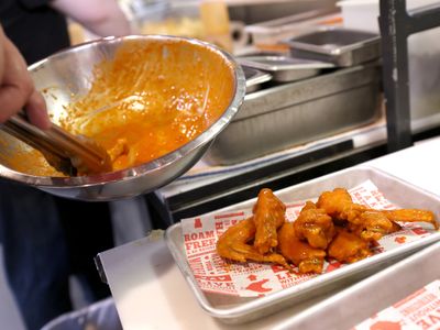 Good thing, wings cost less and beer's flat: Super Bowl fans are expected to splurge