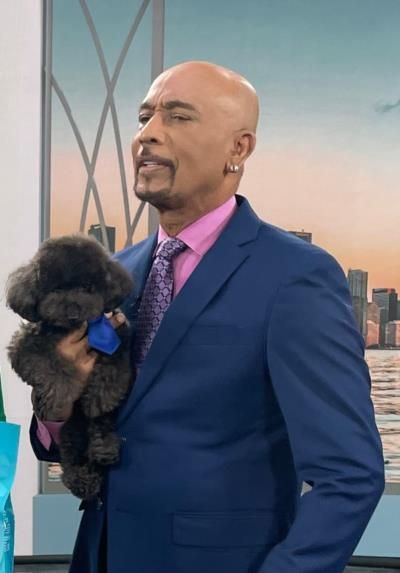 Montel Williams: Fashionable and Loving Pet Owner in Charming Snapshot