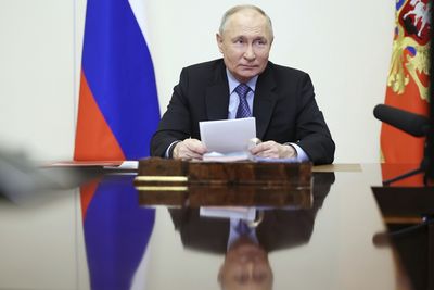 Russia’s Putin signs law to seize assets of those who discredit military