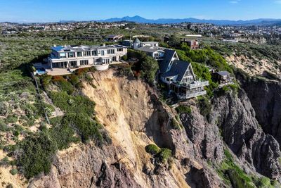 California landslide leaves luxury homes precariously perched on cliff
