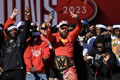 Travis Kelce chugged a beer with a Jason Kelce cardboard cutout at the Chiefs Super Bowl parade