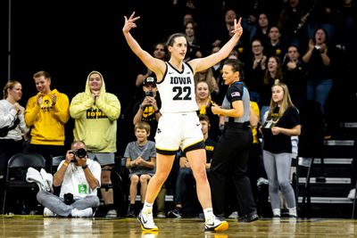 Caitlin Clark broke the NCAA scoring record on a sideline 3-point logo shot because of course she did