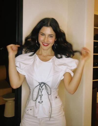 Elegance Captured: Marina's Timeless Style in Serene White Outfit