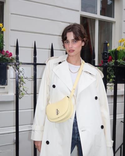 Taylor Hill Radiates Elegance in White Trench Coat Fashion Statement