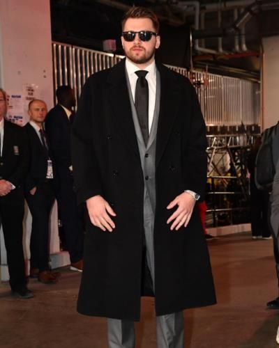 Luka Doncic Showcases Sophisticated Style in Long Black Coat