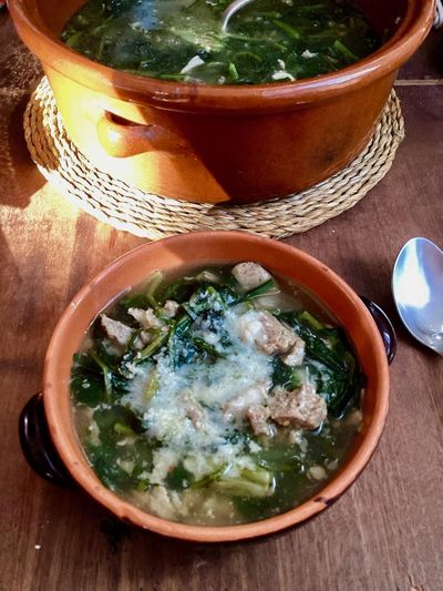 Rachel Roddy’s Neapolitan-inspired soup with greens, sausage and cheese