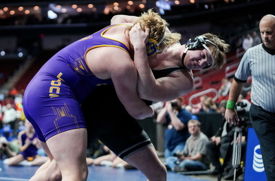 Who are the 4 Iowa football commits competing in the state wrestling tournament?