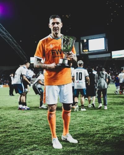 Marco Materazzi Celebrates Victory in Hong Kong Soccer Match Snapshot