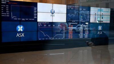 Aust shares edge lower on big day for earnings reports
