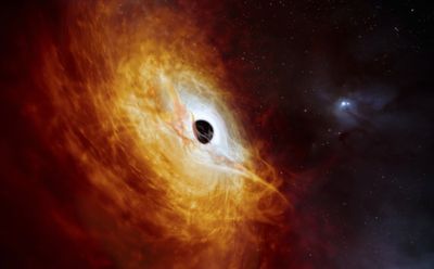 Scientists have found a black hole so large it eats the equivalent of one sun per day