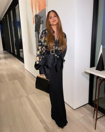 Chrissy Teigen Stuns In Elegant Black Outfit, Radiates Sophistication