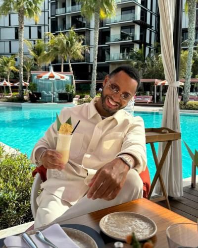 Terrence J Embracing Vacation Vibes With Piña Colada Refreshment