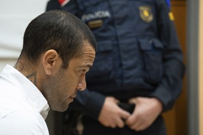 Soccer star Dani Alves is found guilty of rape and sentenced to 4 1/2 years in prison