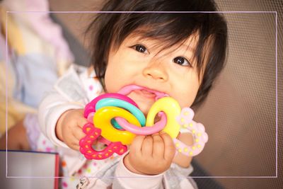 This is the real reason why babies put everything in their mouth, according to an expert (and no, it's not just because they're teething)