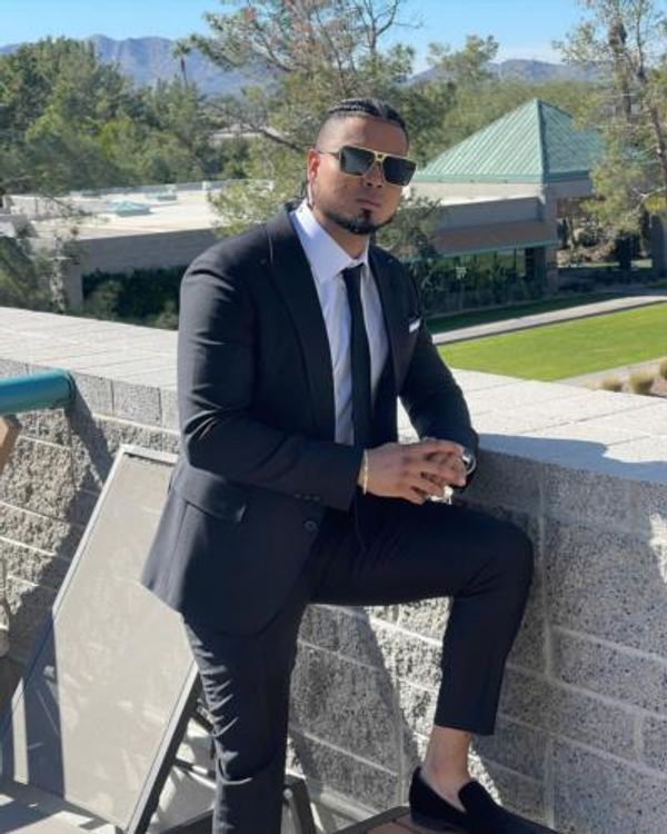 Luis Arraez: Timeless Elegance In Sophisticated Black Suit Pose