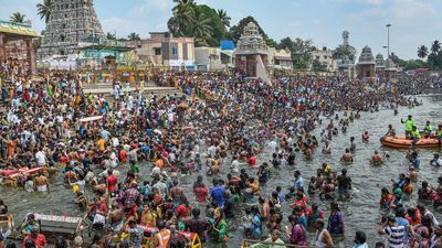 Thousands take a holy dip at the temple tank in Kumbakonam during ‘Masi Maham’