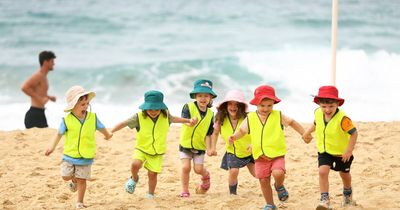 Kindy on the beach: pre-schoolers learn risks of fun in the sun