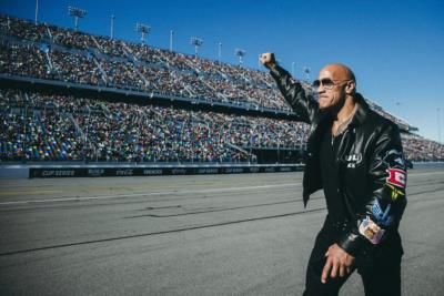 Dwayne Johnson: Charismatic Speedster On The Racing Track