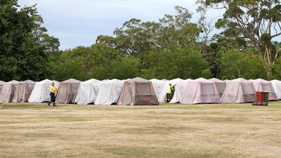 Tent town springs up as help arrives for fire fight
