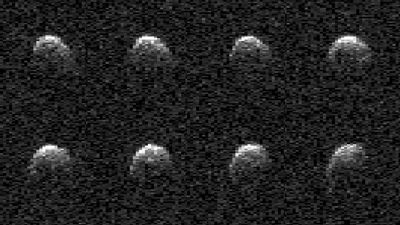 NASA radar images show stadium-sized asteroid tumbling by Earth during flyby (photos)