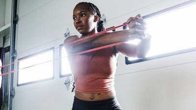 Build upper body muscle with a resistance band and these two simple supersets