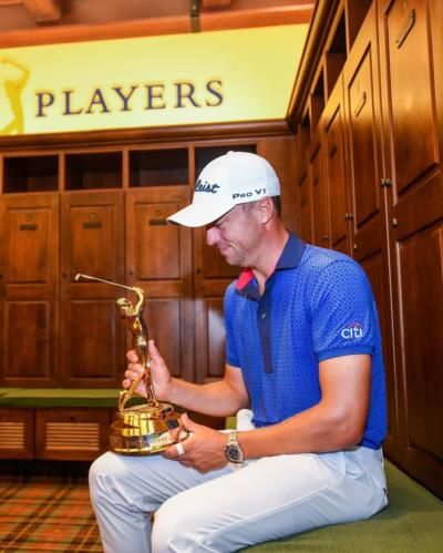 Justin Thomas Celebrates Victory With Trophy