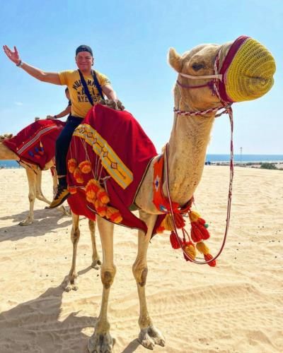 Ray Flores Enjoys Camel Ride At Dunes Of Qatar Beach