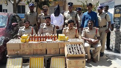Sarpanch held for carrying liquor bottles illegally in Chittoor