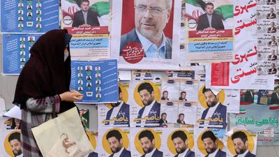 Iran begins voting as conservatives expected to dominate