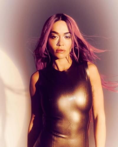 Rita Ora Stuns In Bold Black Outfit With Red Hair