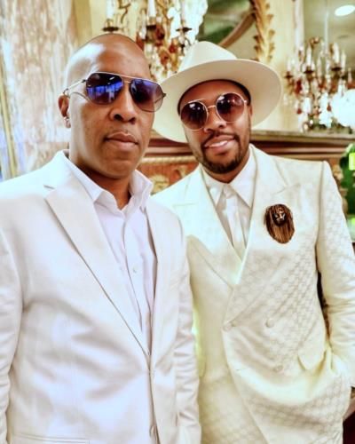 D-Nice And Friend: Stylish Duo In Matching White Suits