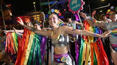 Mardi Gras parade sparkles through sorrow and tension