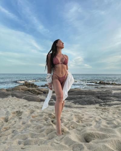 Kelsey Wells Radiates Confidence And Joy In Beach Photoshoot