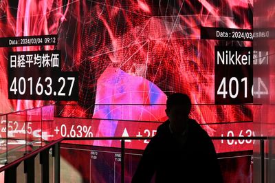 Japan’s Nikkei stock index passes 40,000 for first time amid AI fanfare