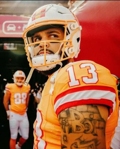 Mike Evans Radiates Confidence And Style In Team Dress Photo