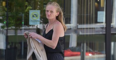 Woman claims 'fixing' golf club-smashed windows before court appearance