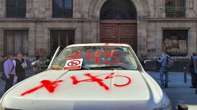 Protesters ram a truck into Mexico's presidential palace over missing students