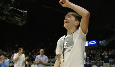 Watch: College basketball fan makes full-court putt (94 feet) for $5,000