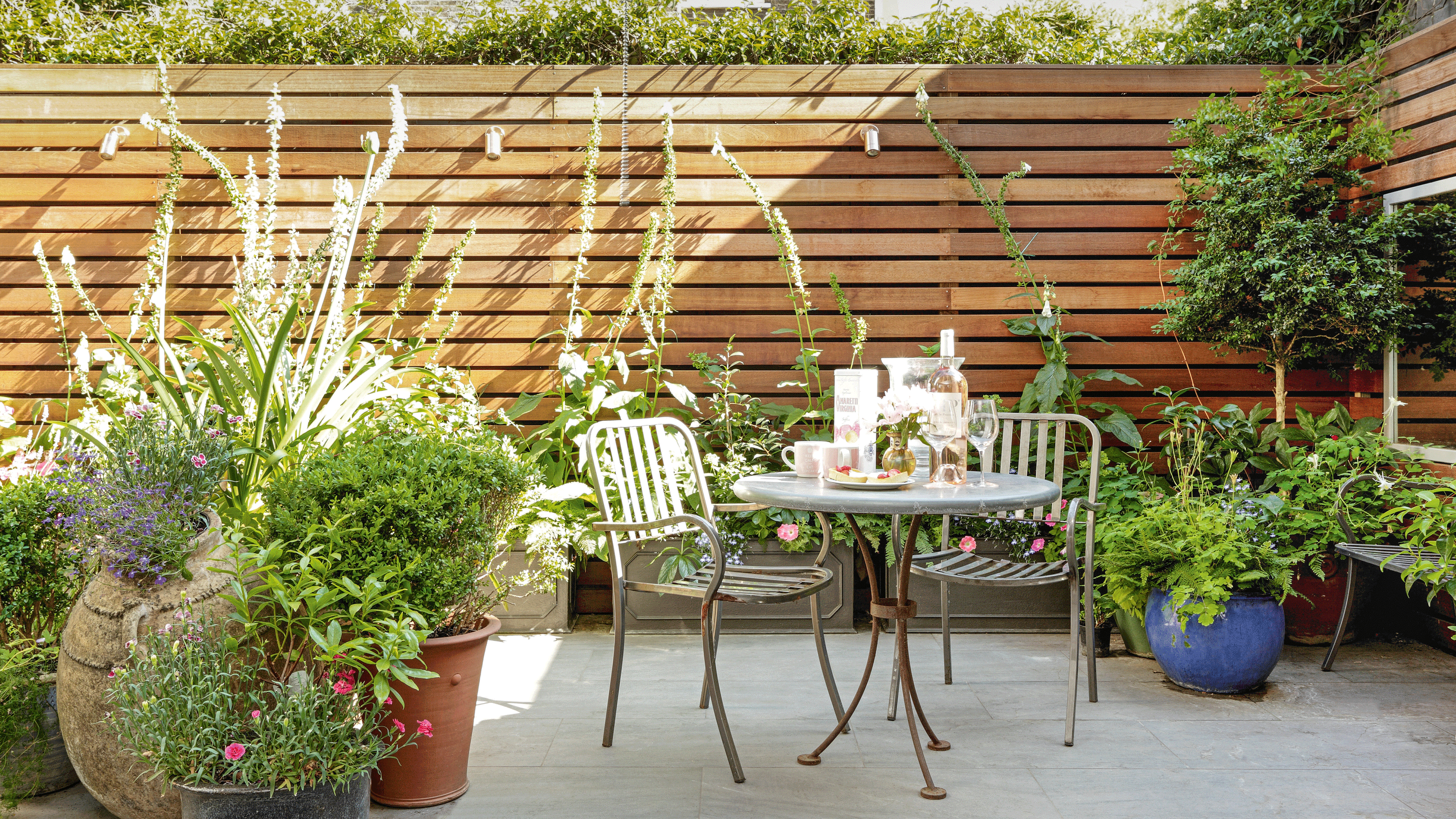 How to arrange pots on a patio - 6 tips for adding plants to a paved over space