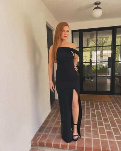 Isla Fisher Radiates Elegance In Stylish Black Dress Pose
