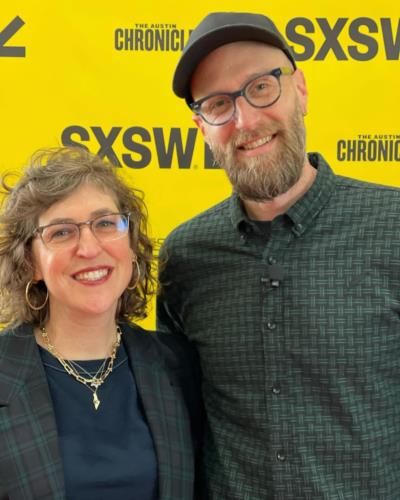 Mayim Bialik And Jonathan Cohen Radiate Joy In Event Photo