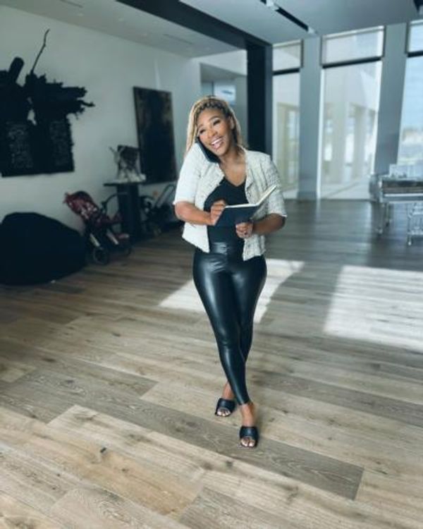Serena Williams: Graceful Multitasking In Sleek Black Outfit