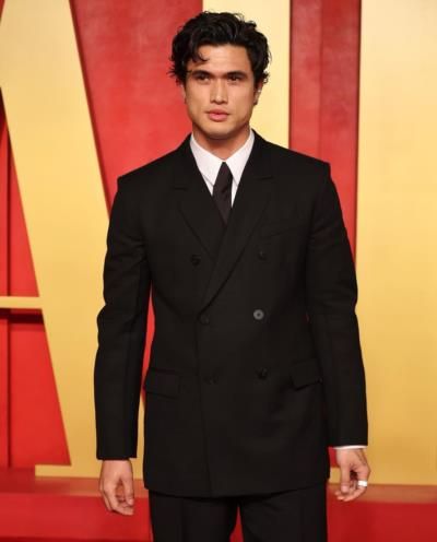 Charles Melton Stuns In Timeless Black Suit With Sophistication