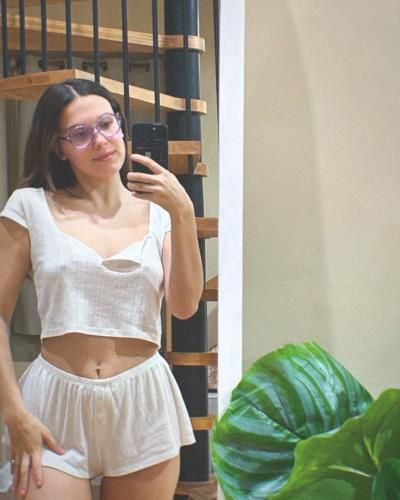 Millie Bobby Brown Radiates Timeless Elegance In White Selfie