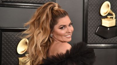 Shania Twain's cabinets exhibit a natural tone that designers are calling the new 'white kitchen'