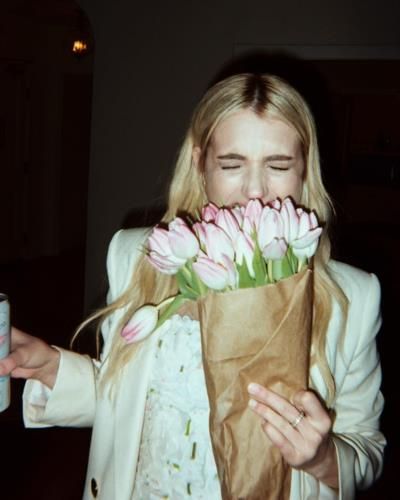 Emma Roberts Radiates Elegance In Flower Bouquet Snapshot