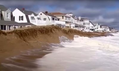Massachusetts town grapples with sea rise after sand barrier fails