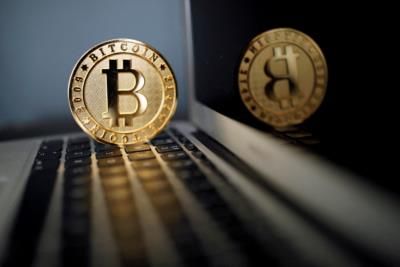 Bitcoin Hits Record High Of ,000 Before Sharp Plunge