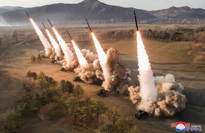 North Korea’s Kim oversees ‘super-large’ rocket launcher drills